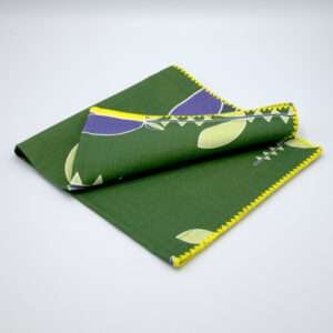 Lip TuLip design dinner napkins in purple folded from hem and tassel