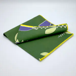 Lip TuLip design dinner napkins in purple folded from hem and tassel