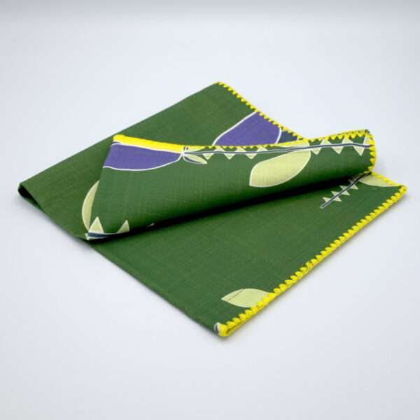 Lip TuLip design dinner napkins in purple folded from hem and tassel