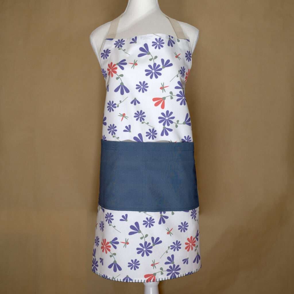 Shy dragonfly design apron with purple flowers on mannequin from hem and tassel