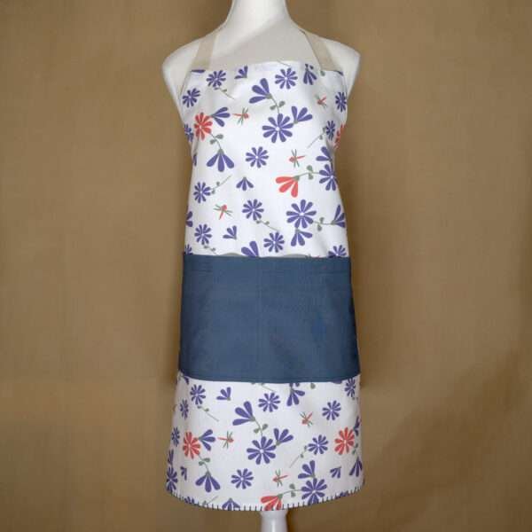 Shy dragonfly design apron with purple flowers on mannequin from hem and tassel
