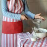 Girl wearing everyday classic apron for cooking and baking