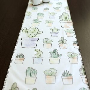 Table runner with hazy desert cactus print and cups