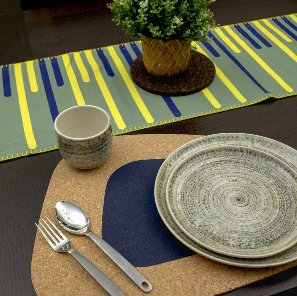 Yellow PIano design table runner LS with blue kidney bean cork placemat from hem and tassel