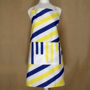 Yellow piano apron on mannequin from hem and tassel