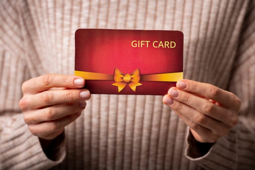 woman holding beautiful gift card in her hands