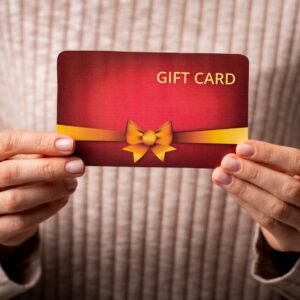 woman holding beautiful gift card in her hands