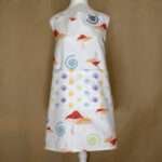 magic mushroom design apron on mannequin from hem and tassel