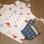 magic mushroom design apron with oven mitt and pot holder flat from hem and tassel