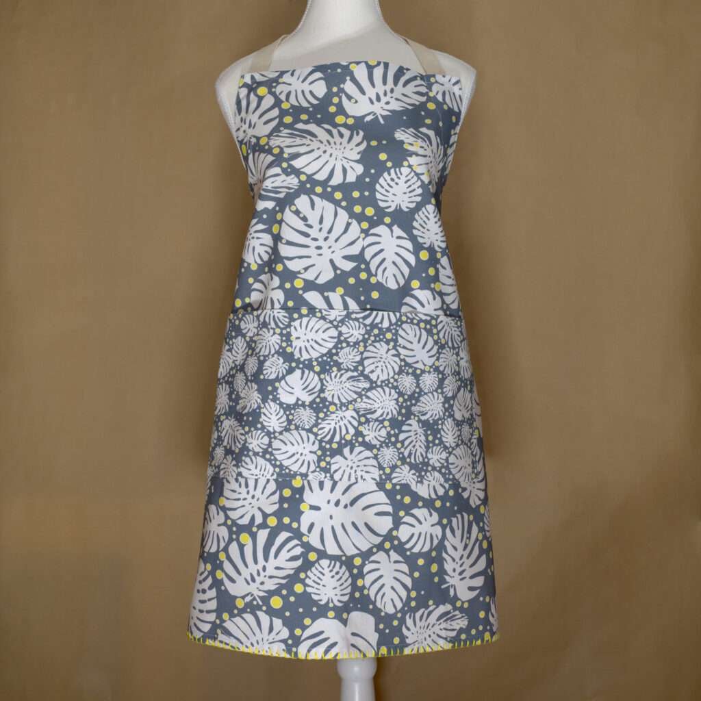 monster-ah design apron in oil on mannequin from hem and tassel