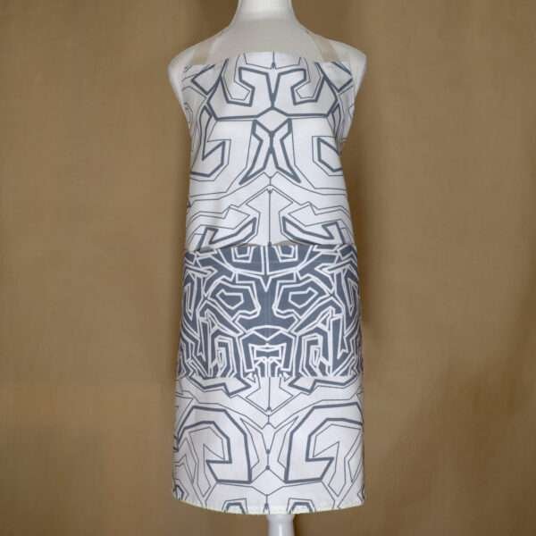 squiggles symmetric design apron in oil on mannequin from hem and tassel
