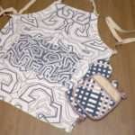 squiggles symmetric design apron in oil with jute impossible oven mitt and pot holder flat from hem and tassel