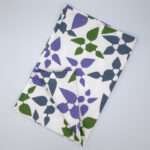 Celebration design tea towel in oil flat folded from hem and tassel