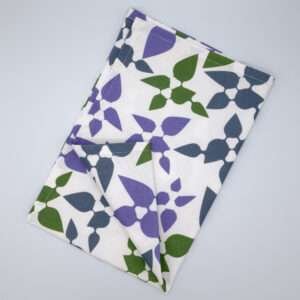 Celebration design tea towel in oil flat folded from hem and tassel