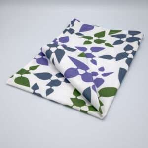 Celebration design tea towel in oil folded from hem and tassel