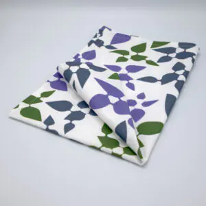 Celebration design tea towel in oil folded from hem and tassel