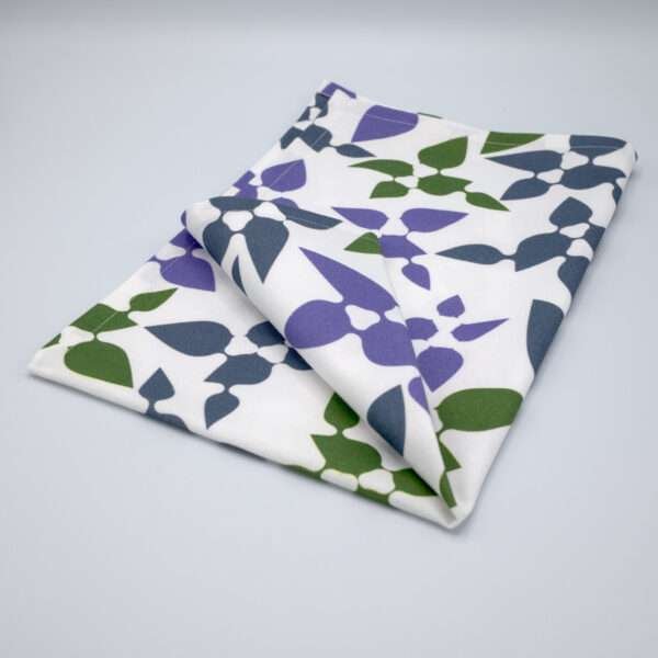 Celebration design tea towel in oil folded from hem and tassel