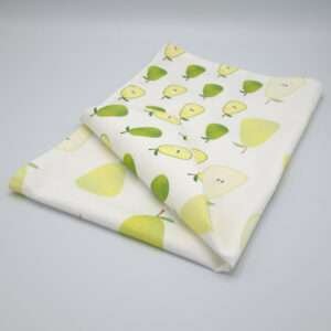 Faded pear design tea towel folded from hem and tassel