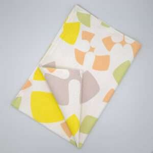 Flock and Flutter design tea towel in slate flat folded from hem and tassel