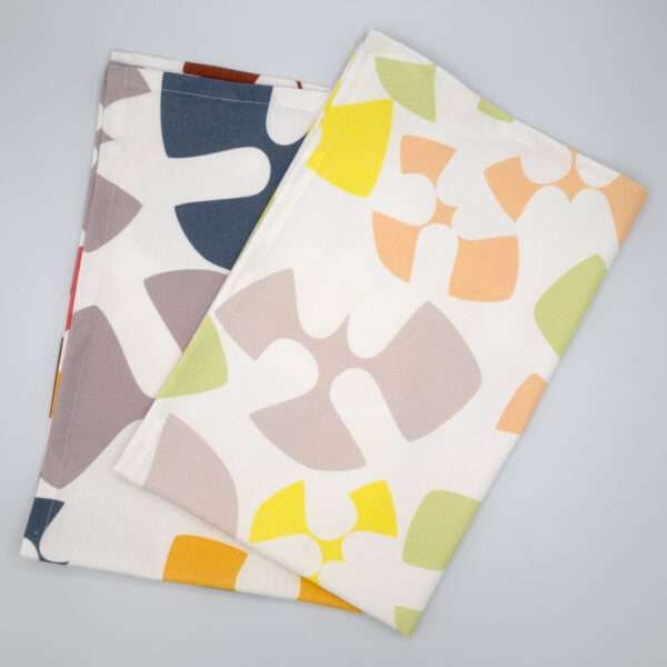 Flock and Flutter design tea towels in slate and grey flat folded from hem and tassel
