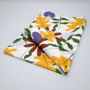 Just leaves design orange oak tea towel folded from hem and tassel