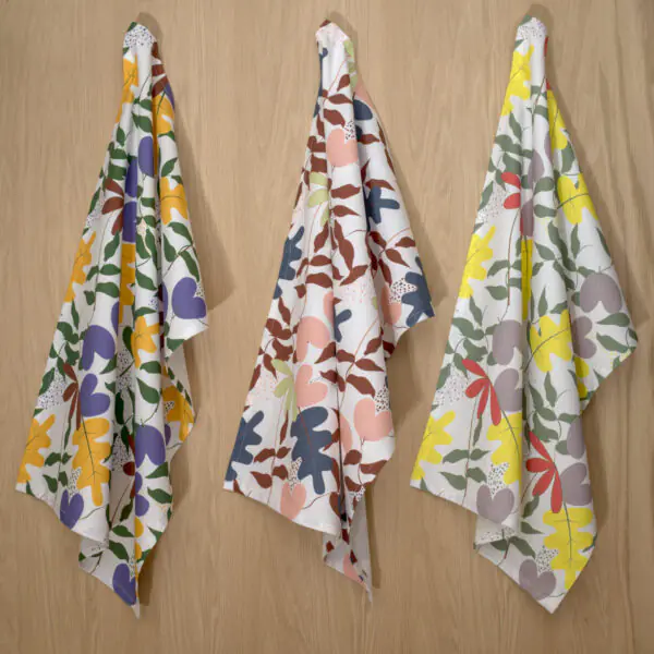 Just leaves design three hanging tea towels from hem and tassel