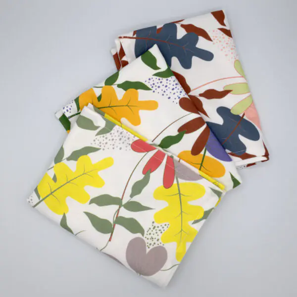 Just leaves design three tea towels fanned from hem and tassel