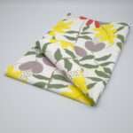 Just leaves design yellow oak tea towel folded from hem and tassel