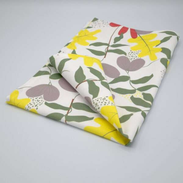 Just leaves design yellow oak tea towel folded from hem and tassel