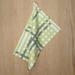 Jute Impossible checked design hanging tea towel in mint from hem and tassel
