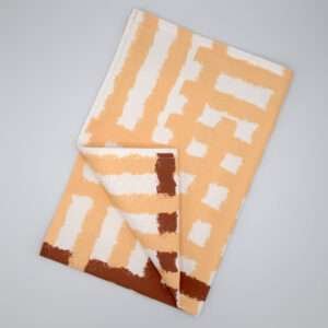 Jute impossible checked design tea towel flat folded in buff from hem and tassel