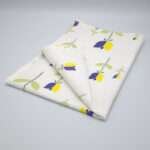 Lip TuLip design purple tea towel folded from hem and tassel