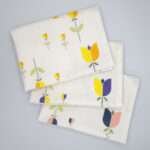 Lip TuLip design three tea towels fanned from hem and tassel