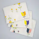 Lip TuLip design three tea towels fanned from hem and tassel