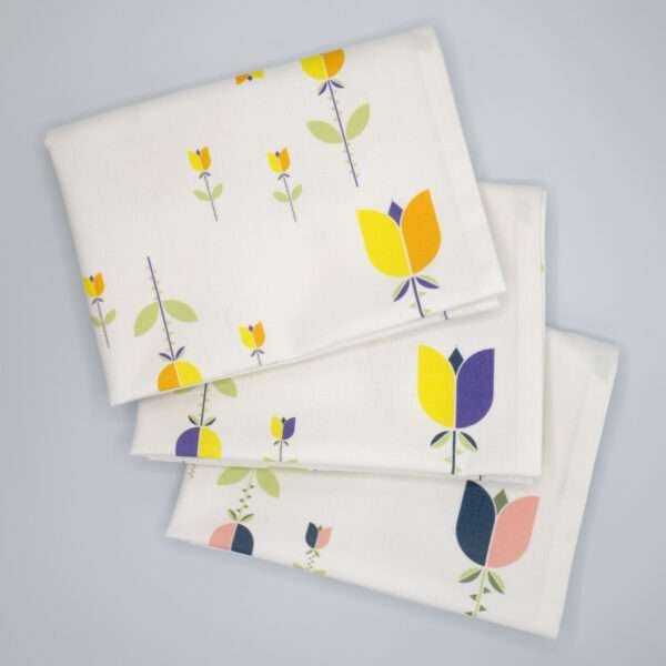 Lip TuLip design three tea towels fanned from hem and tassel
