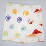 Magic and magic mushroom design tea towels fanned out from hem and tassel