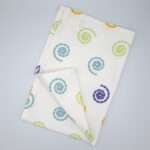 Magic design tea towel flat folded from hem and tassel