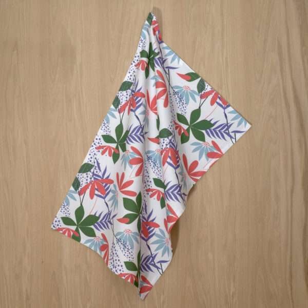 Pollen Up design hanging tea towel in pink from hem and tassel