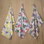 Pollen Up design three hanging tea towels from hem and tassel
