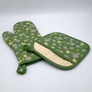 Shy dragonfly design mitt and pocketed hot pad in green from hem and tassel