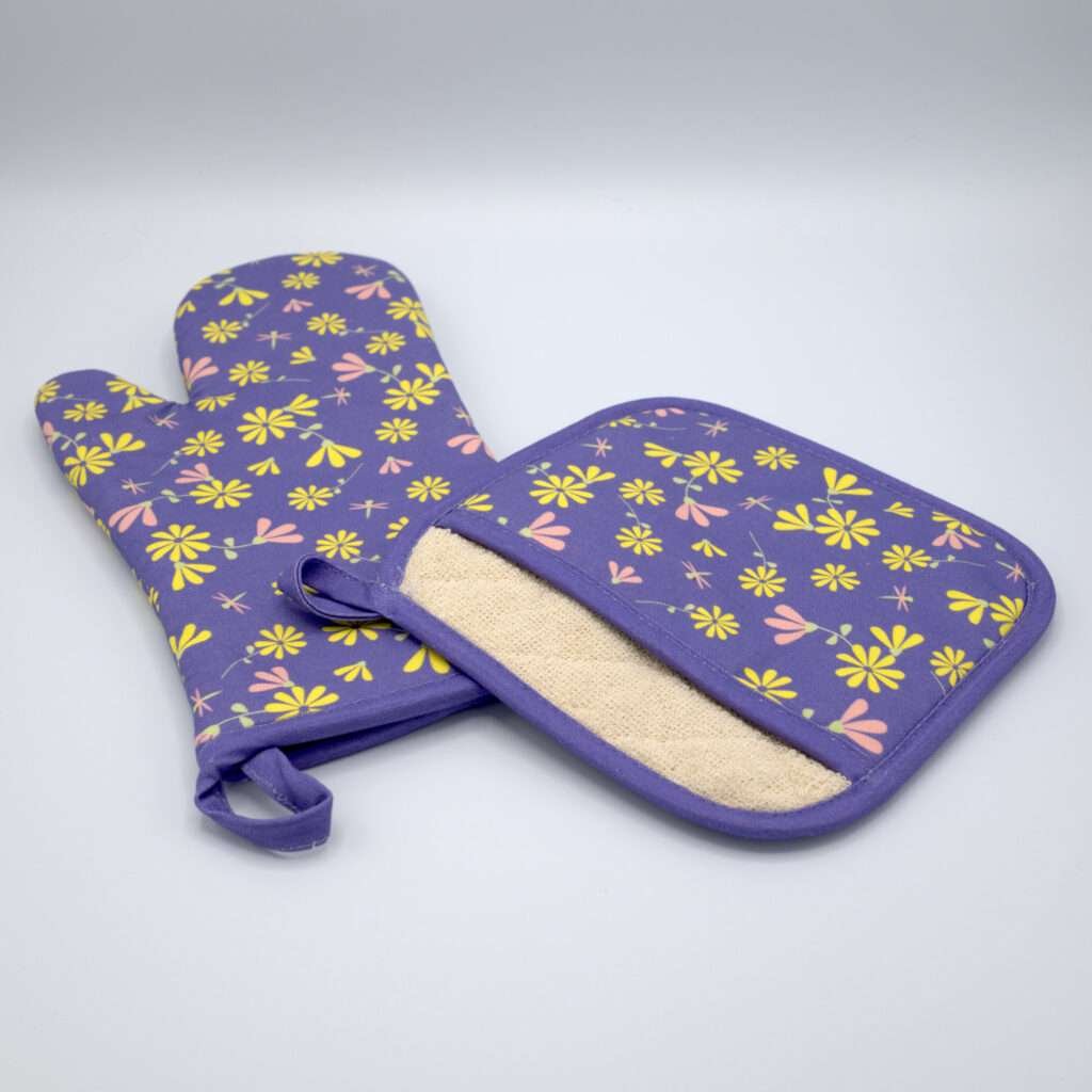 Shy dragonfly design mitt and pocketed hot pad in purple from hem and tassel