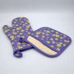 Shy dragonfly design mitt and pocketed hot pad in purple from hem and tassel