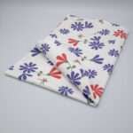 kitchen towel in shy dragonfly hiding design with purple and pink flowers