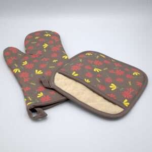 Shy dragonfly design mitt and pocketed hot pad in clay from hem and tassel