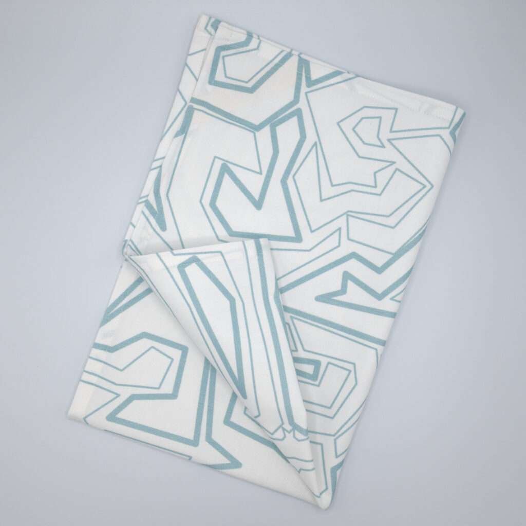 Squiggles geometry design blue tea towel flat folded from hem and tassel