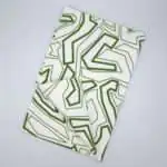 Squiggles geometry design green tea towel flat folded from hem and tassel