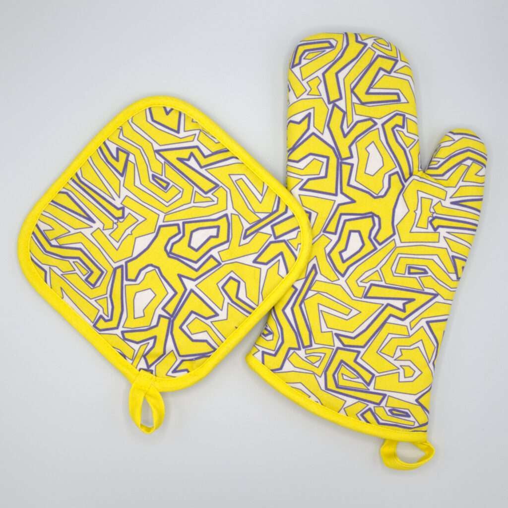 Squiggles maze design mitt and hot pad in yellow from hem and tassel