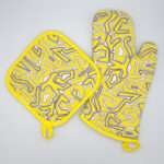 Squiggles maze design mitt and hot pad in yellow from hem and tassel
