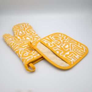 Squiggles maze design mitt and pocketed hot pad in orange from hem and tassel