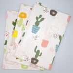 Thorny issue design set of three tea towels fanned from hem and tassel